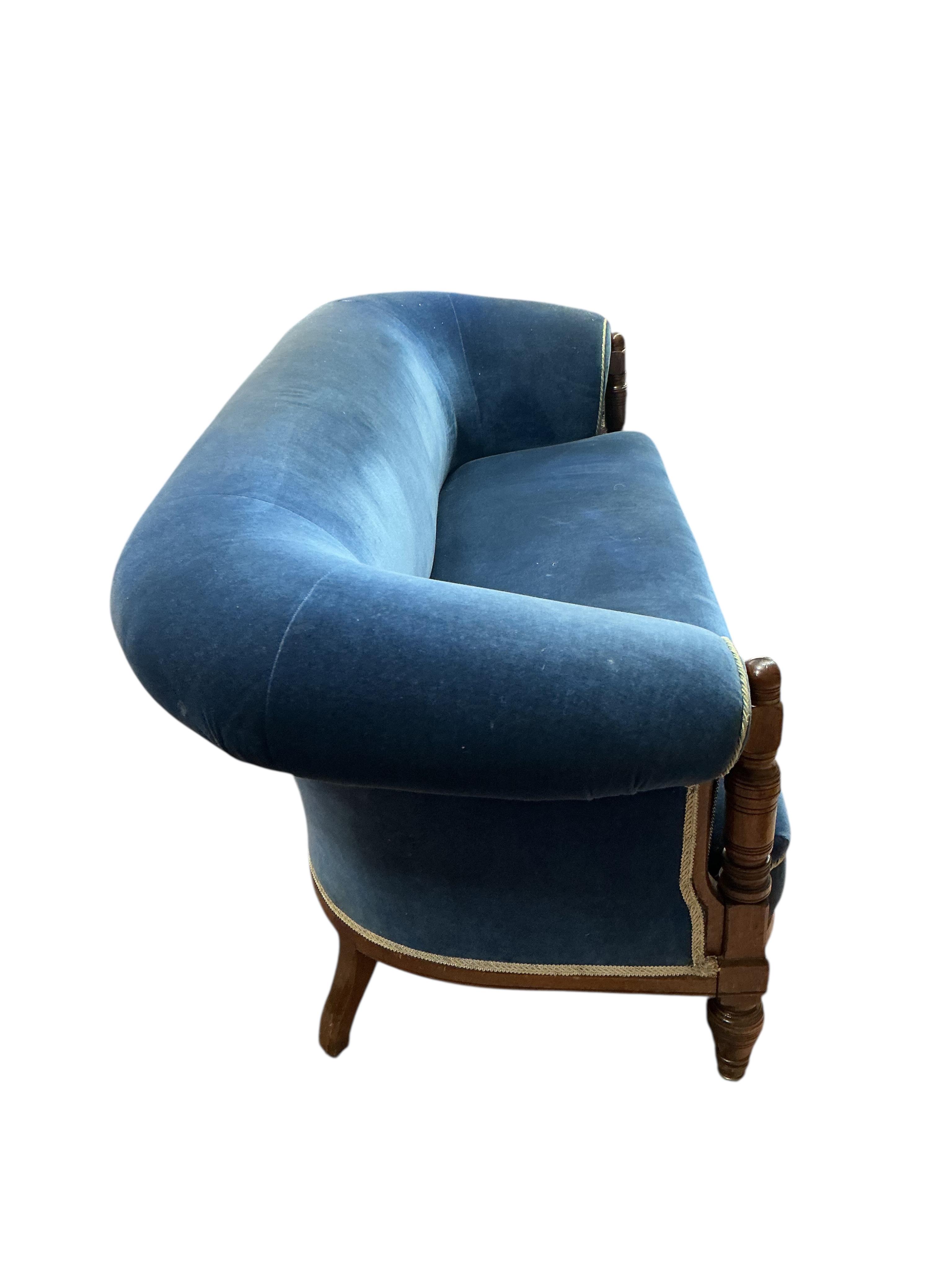 A late Victorian upholstered mahogany settee, width 200cm, depth 86cm, height 76cm.